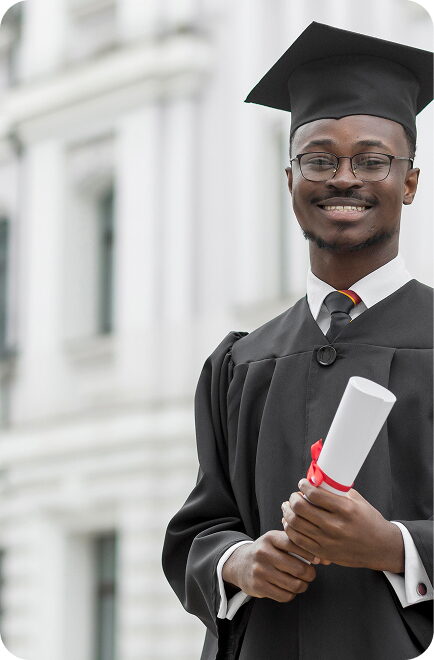 An FGC Kano graduate in cap and gown holding a rolled diploma