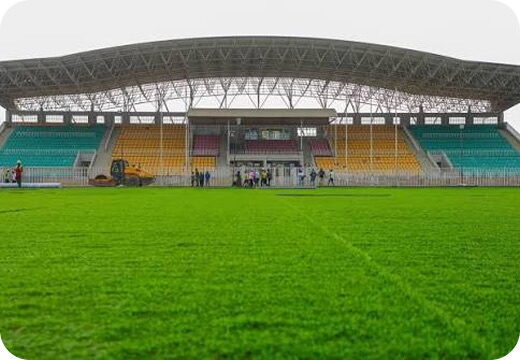 A football stadium pitch and covered stand