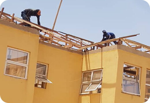 Roofing works underway on a hostel block